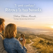 Crescita personale: uomo e donna osservano una bussola e guardano l’orizzonte alla ricerca di una nuova direzione nella vita
